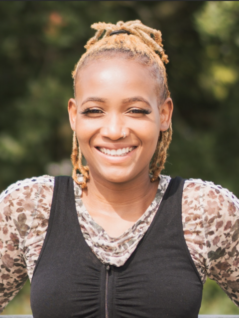 Colour photo of Vivian Tanaka looking straight to camera